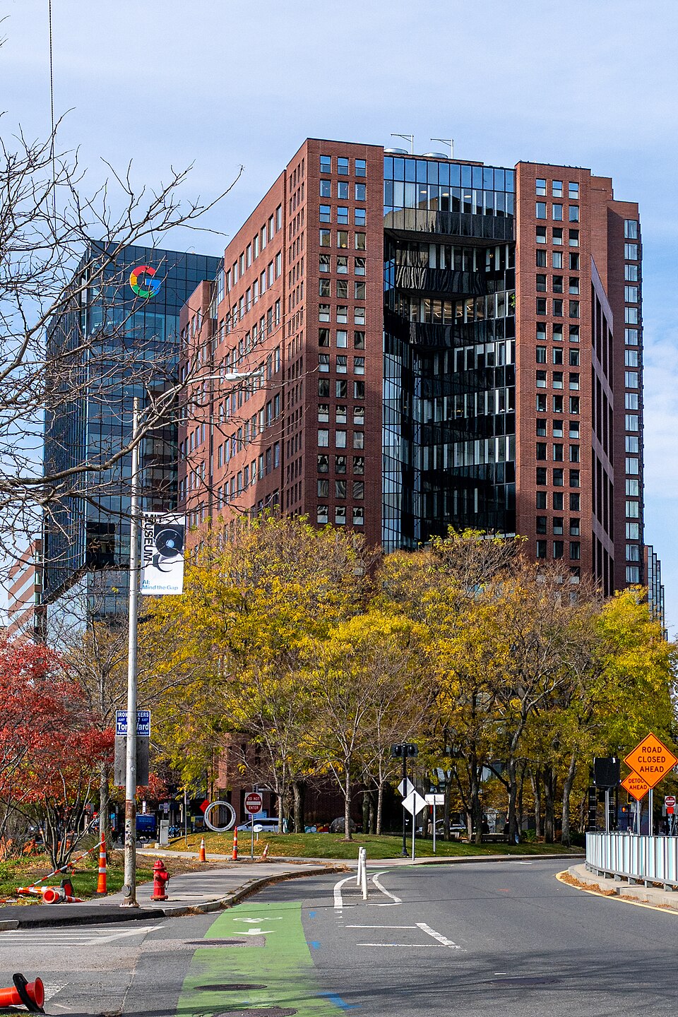 Kendall Square, Cambridge, with the Google building rising over autumn trees